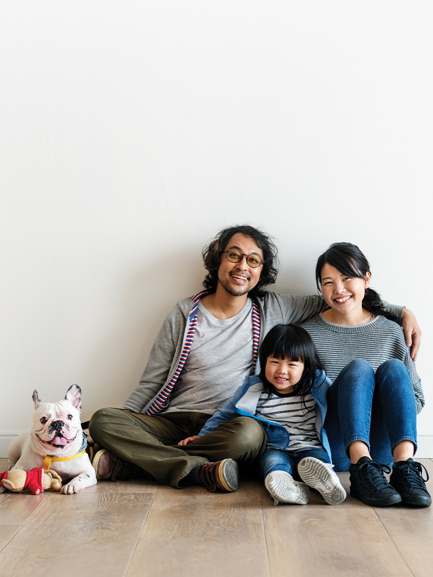Child on Luxury Vinyl Floor putting Money in Piggy Bank